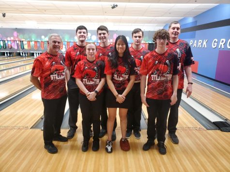Varsity Bowling Team posing for a photo at a tournament.