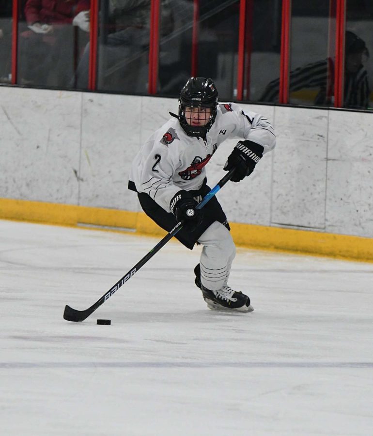 Dustin is looking up ice trying to gain some space while also looking to make a play.