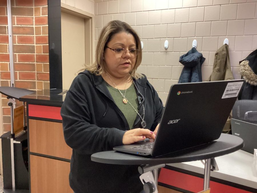 Sandy Cortez monitors the hallways on the computer to ensure student safety.