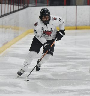 Ty Tuccitto carries the puck down the ice at the St. Croix Valley Rec Center.