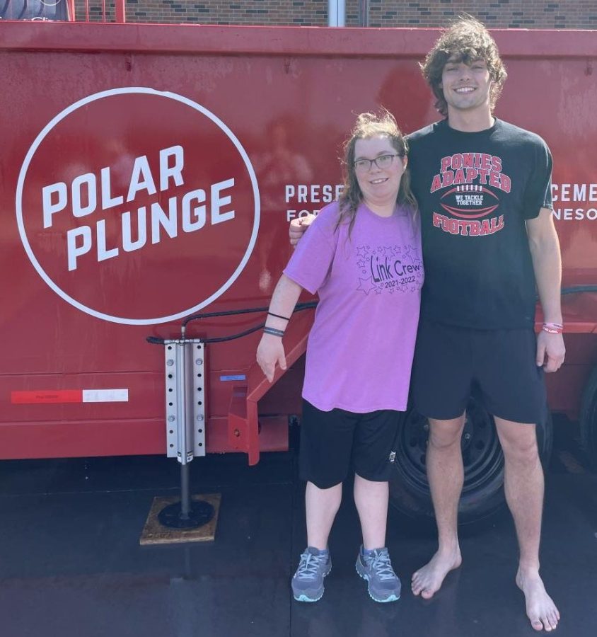 students standing in front of polar plunge tank