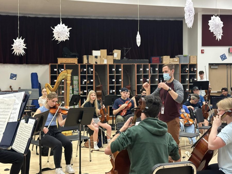 Jensen conducting a small group of string players