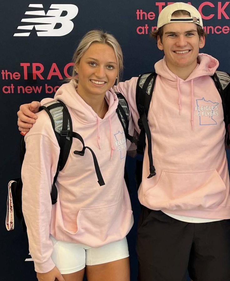 Jackson Tweed and Sophia Rosoki taking a picture together at New Balance Nationals.
