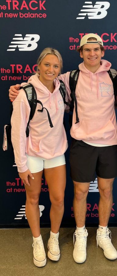 Jackson Tweed and Sophia Rosoki taking a picture together at New Balance Nationals.