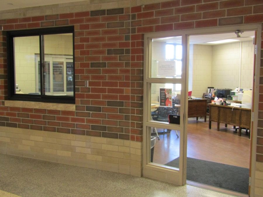 The pathways office is empty. Located in the cafeteria between two doorways.