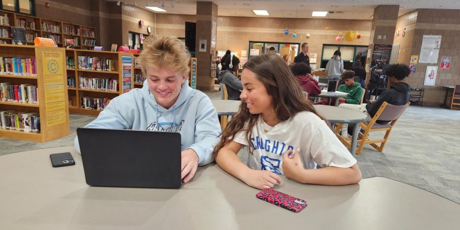 Student council member of senior Isabelle Adams helps students in the media center, coming up with ideas on how to make school a better place.