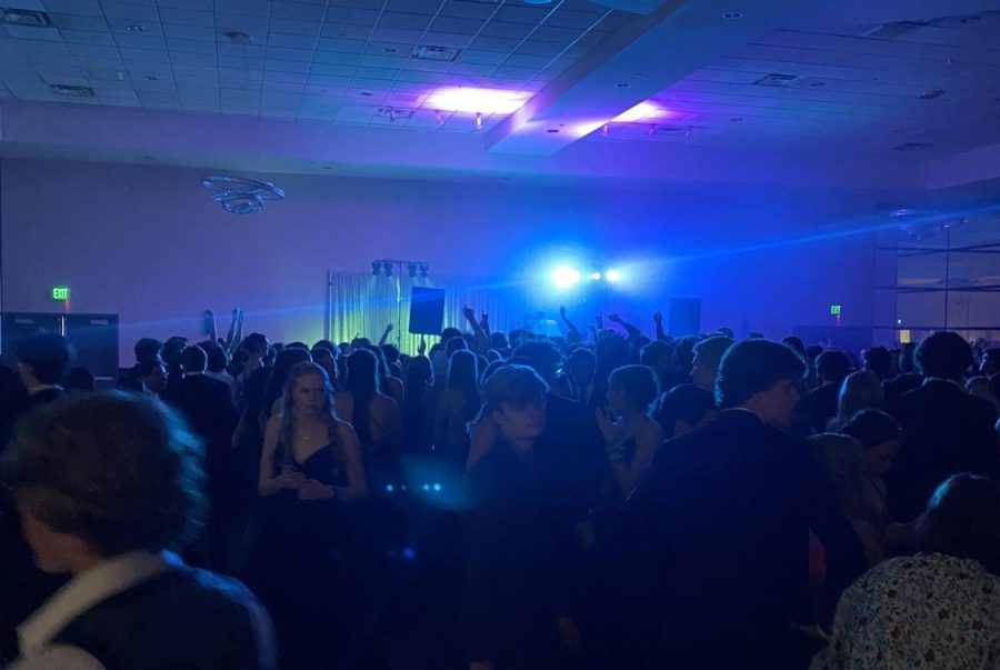 Students are having the time of their lives dancing at prom.