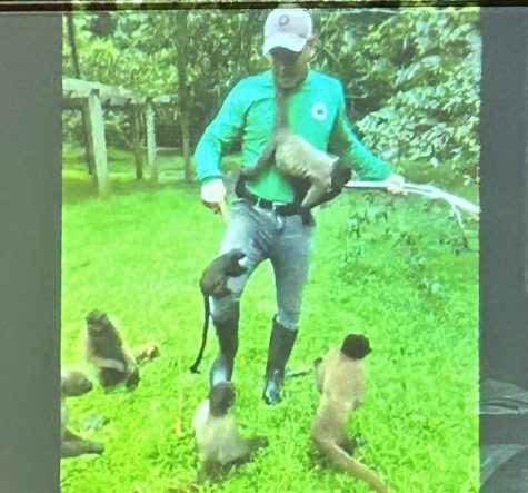 Jair on zoom while playing with monkeys.