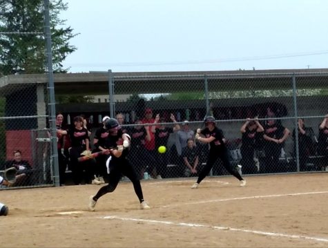 Senior Alexis Monty hits the ball at a home game vs. Woodbury on May 12. The team showed their skill, played hard and won the game 5-0.