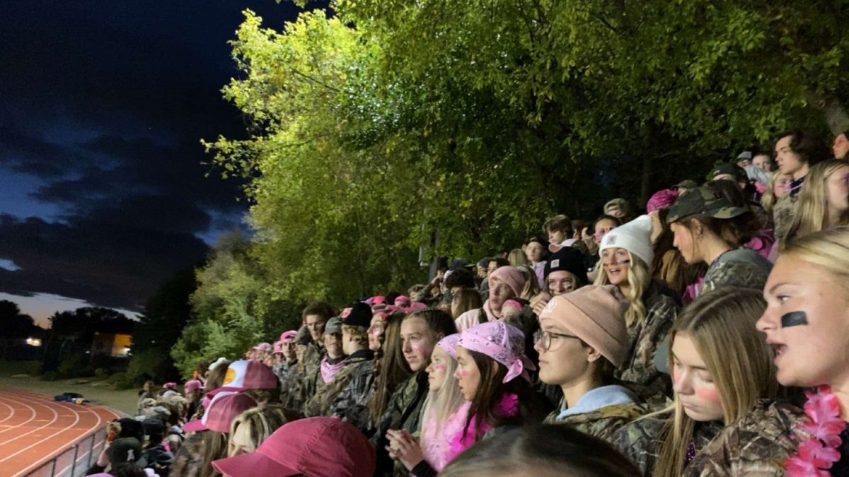 This is the student section at the White Bear football game on Oct. 6. Superfans helped organize the camouflage out theme, showing the students school spirit.