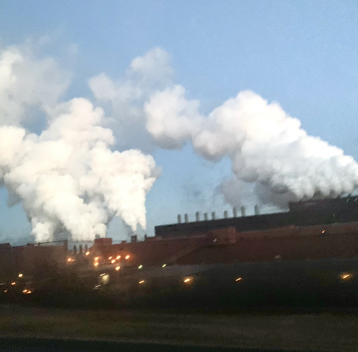 Gas goes into the air from a natural gas factory located on the north shore of Lake Superior. These factories produce 30% less carbon emissions than oil factories, but still are a main contributor to climate change as a whole. 