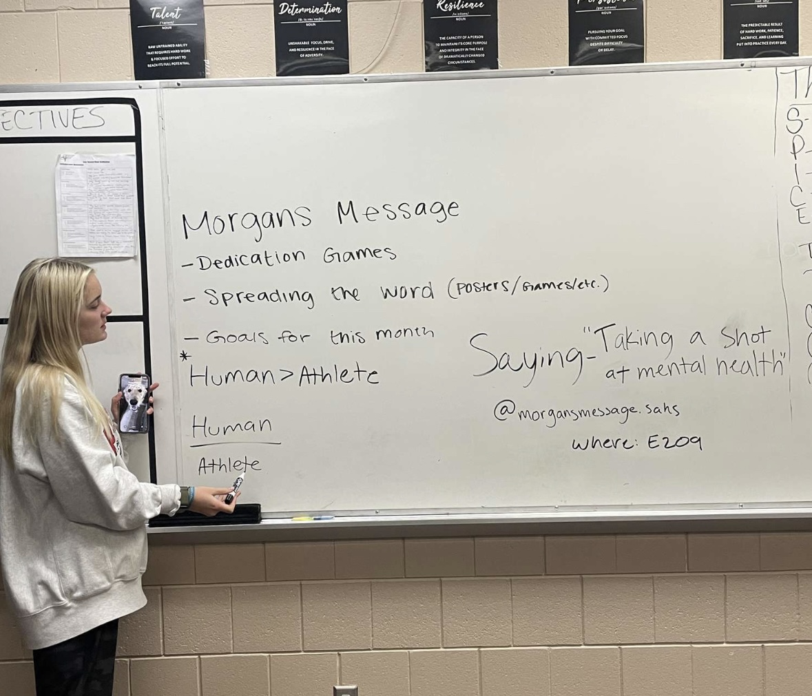 Elsa Swenson is at a Morgans Message meeting on Nov. 13 writing down what to put on posters to hang around the school. Swenson is a Morgans Message ambassador who runs the meetings along with three other girls.  
