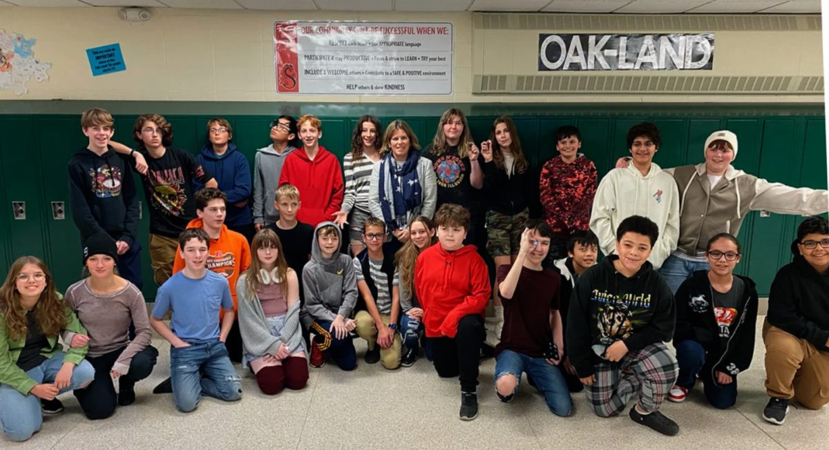 The students surround the new Principal Ann Giardino in Oak-Land Middle School. Giardino is a welcomed and accomplished addition to the school.