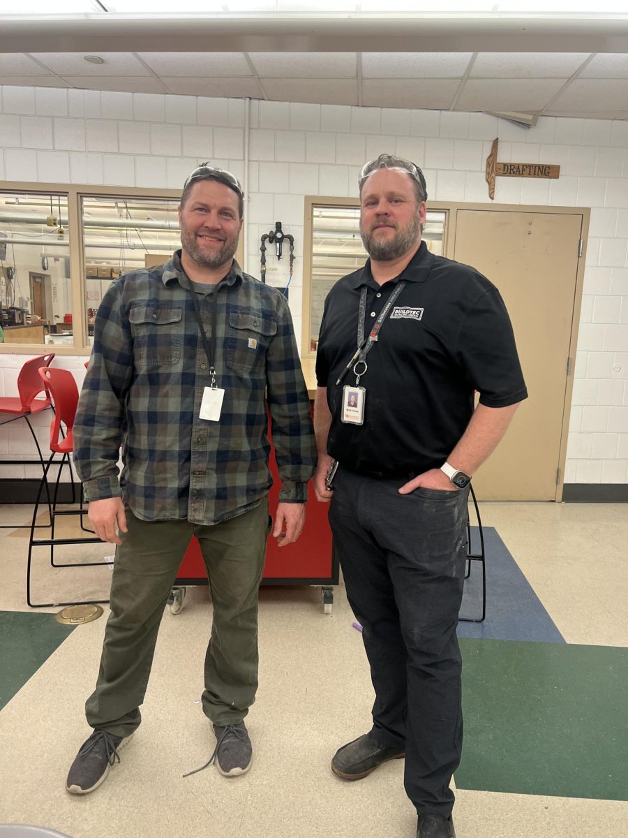 Brad Pike and Matt Howe in the woodshop classroom after a long day helping students who are struggling and attending meetings. Cleaning up the classroom to get ready for the next day to ensure the safety policies and rules.