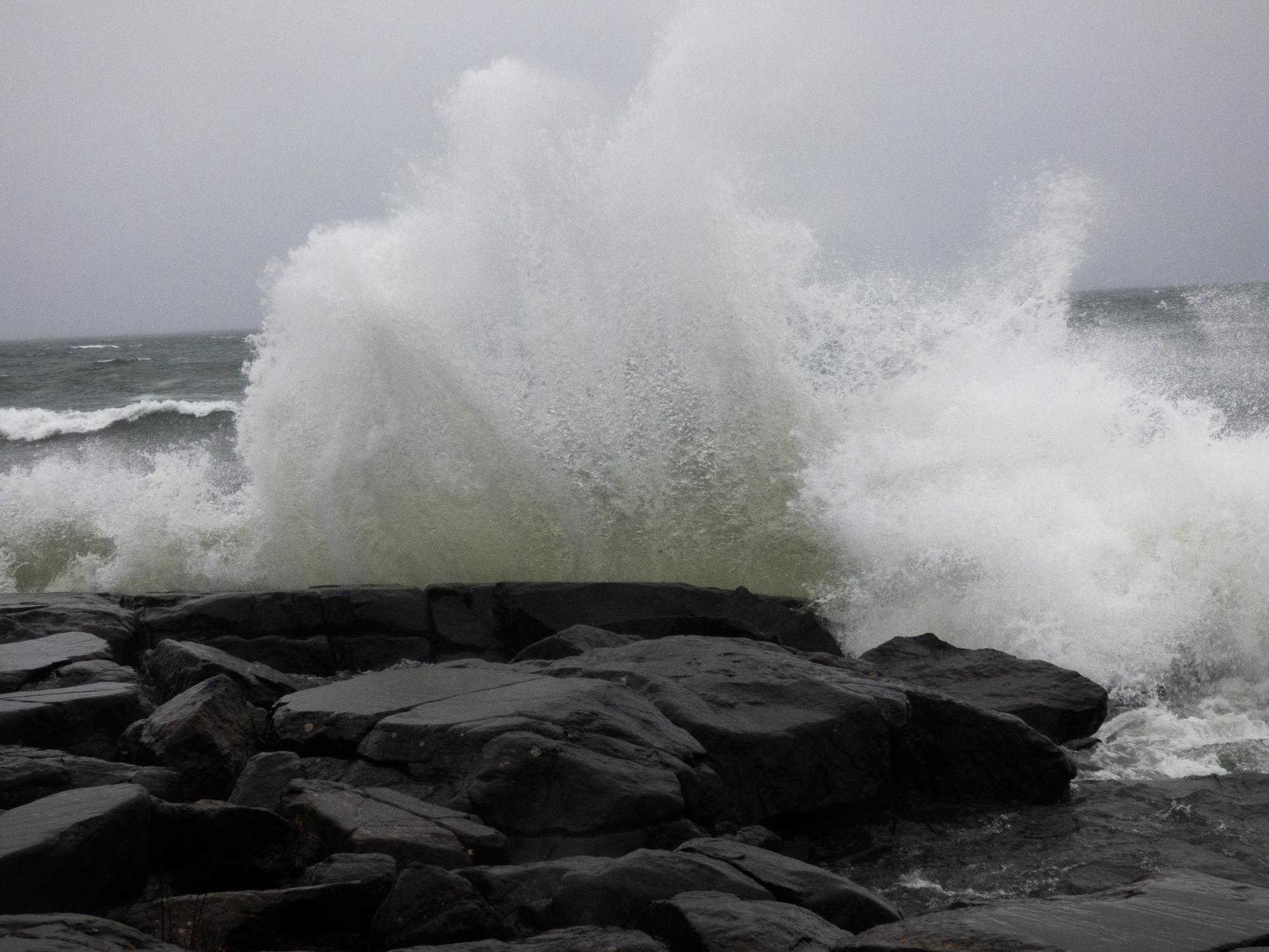 Lake Superior waves crash against the rocks at Stoney Point in Duluth, Minn. The lake would normally be at least slightly frozen over, but due to warmer temps and more rain storms, 10-15 foot waves have been rolling in. 