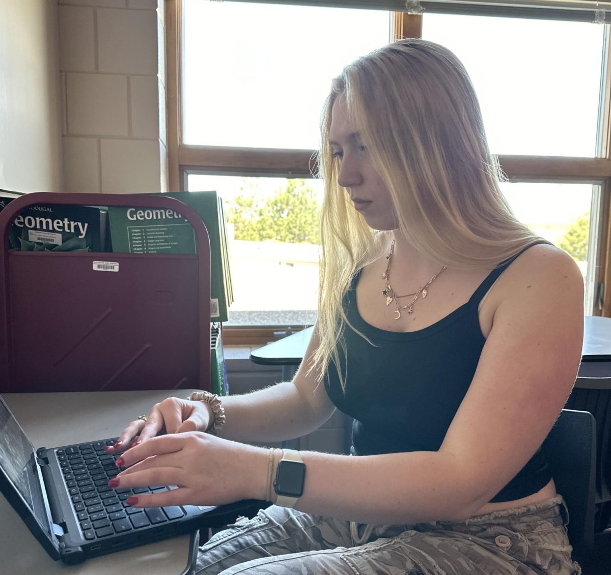Junior Maysen Puhrmann organizes her calendar for the next couple weeks. She is constantly on the move, always filling up her time with activities.