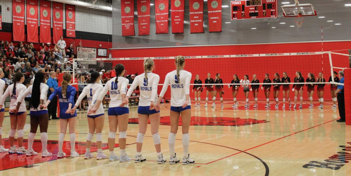 The Stillwater Ponies and Woodbury Royals face each other hand In hand as they prepare for the coming game. Unknowing of who will take home the victory of tonights game, there is suspense in the air. 