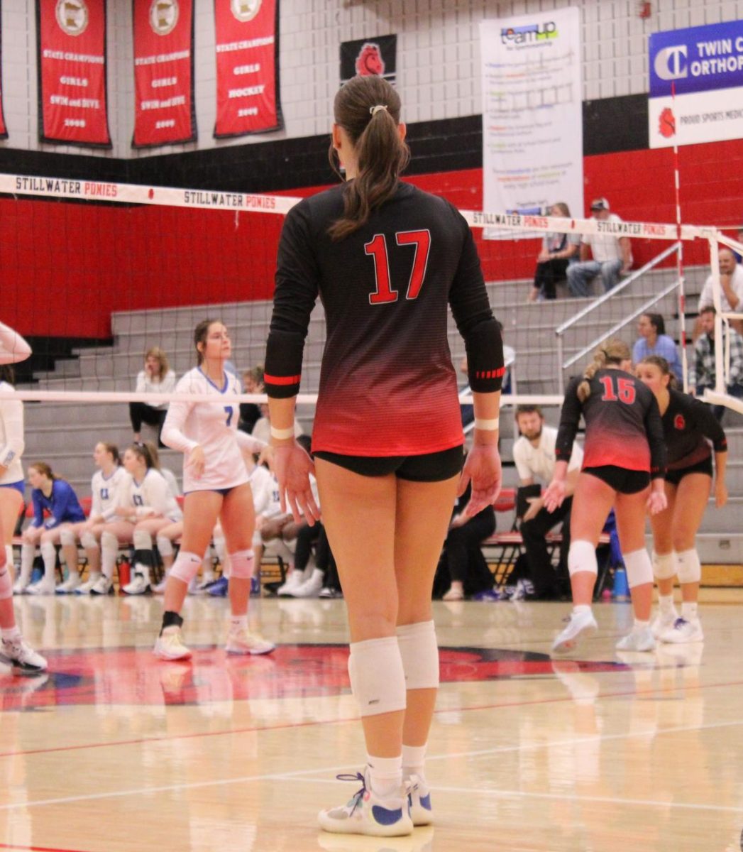 Varsity team captain Courtney Peters gets into her position for the next play, ready to show off her athletic abilities. "She is someone the rest of the team can depend on. She leads by example and is a confident and reliable player,” new head coach Michael Alexander said.