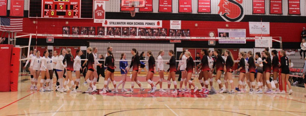 The Stillwater Ponies high-five their defeated opponents, the Woodbury Royals after a very close game at SAHS on Sept. 17th, at 7pm. The game was filled with excitement  and suspense. 