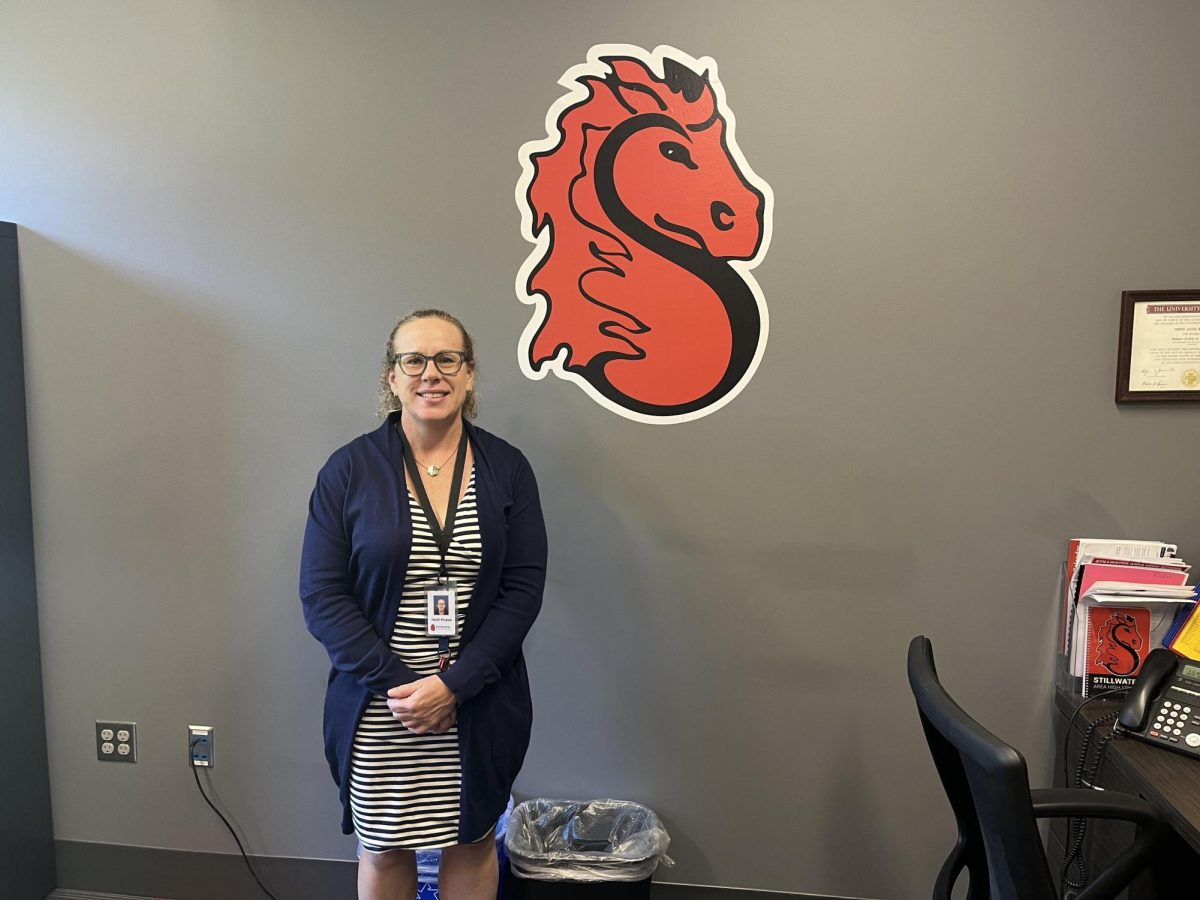 Heidi Klukas standing near Pony. Ms Klukas came from Simley High School and is one of the two new assistant principals at SAHS.