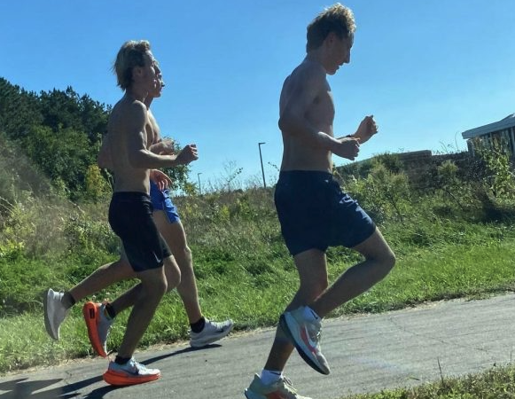 Senior captains Andrew Walsh and Dylan Riniker run during cross country practice. Running during practice is key to their team's success at meets.