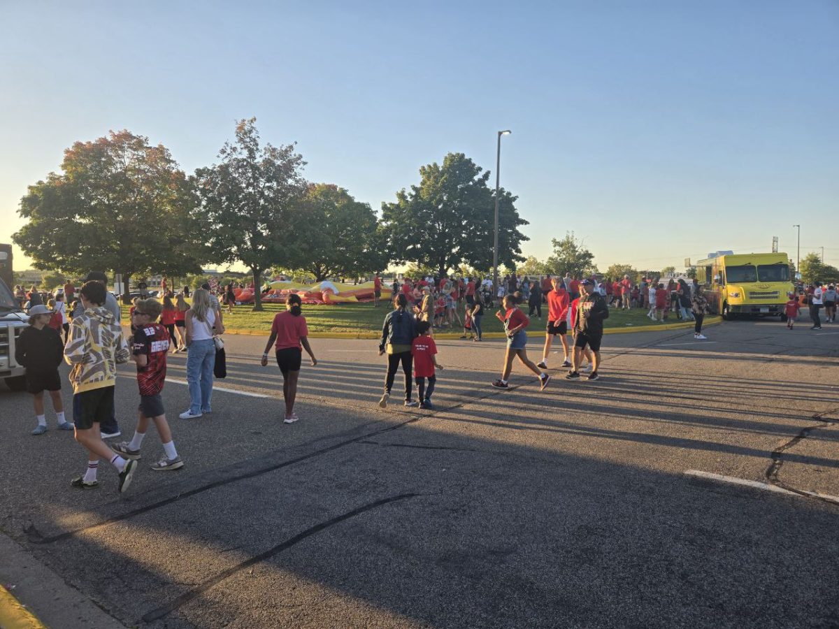 Hundreds of people show up to the carnival before the game in their support of the ponies. In the background you can see food trucks and other events happening at the carnival.