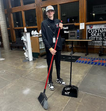 Junior Tyler Schutz sweeps the floor at St. Croix Valley Recreation Center. He is having fun at work and is really enjoying his job in concessions.