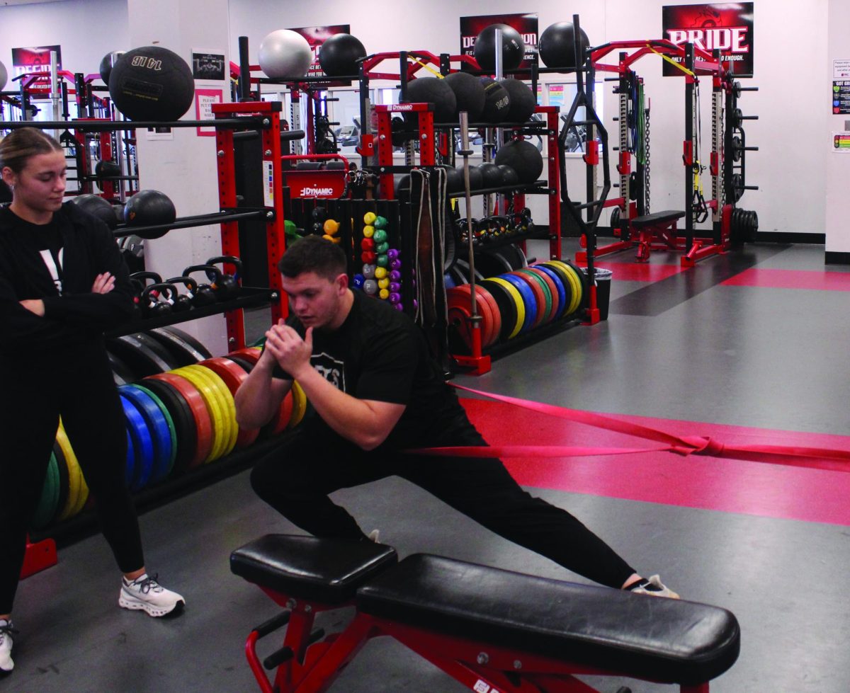 Coach Lucas Garbe shows athletes how to do a workout that they have not heard of. He does a great job explaining new skills so athletes understand.
"He's very good at uplifting and knowing how to handle every situation,"  senior Isaac Hunter said.