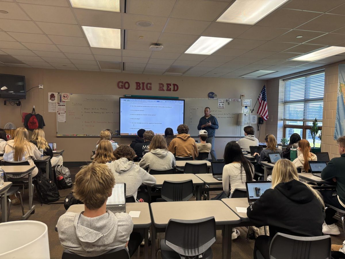 Social Studies teacher Kevin Klancher teaches one of his classes and the students are getting the work done. Klancher loves to teach at the school and be able to see his family at work.