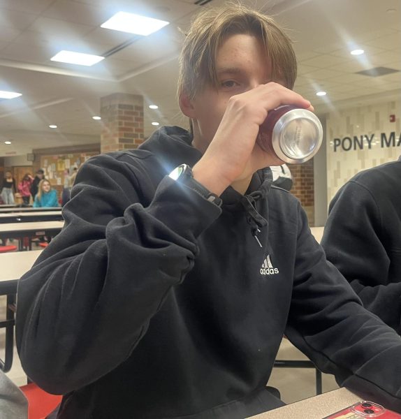 Junior Devin Christensen drinks a sparkling ice caffeine drink before school. These drinks have become popular since the school has started selling them in the cafeteria. Often, things like this become trends across students at the school and show how fast students are able to grow certain items. 