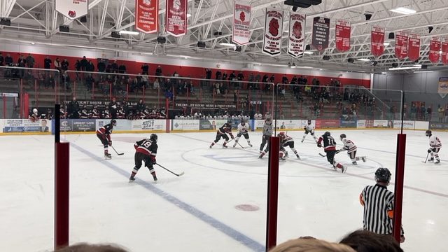 Stillwater vs Eden Prairie Hockey game
Hockey players starting a period off with a puck dual. ponies are winning the game and playing offensively.