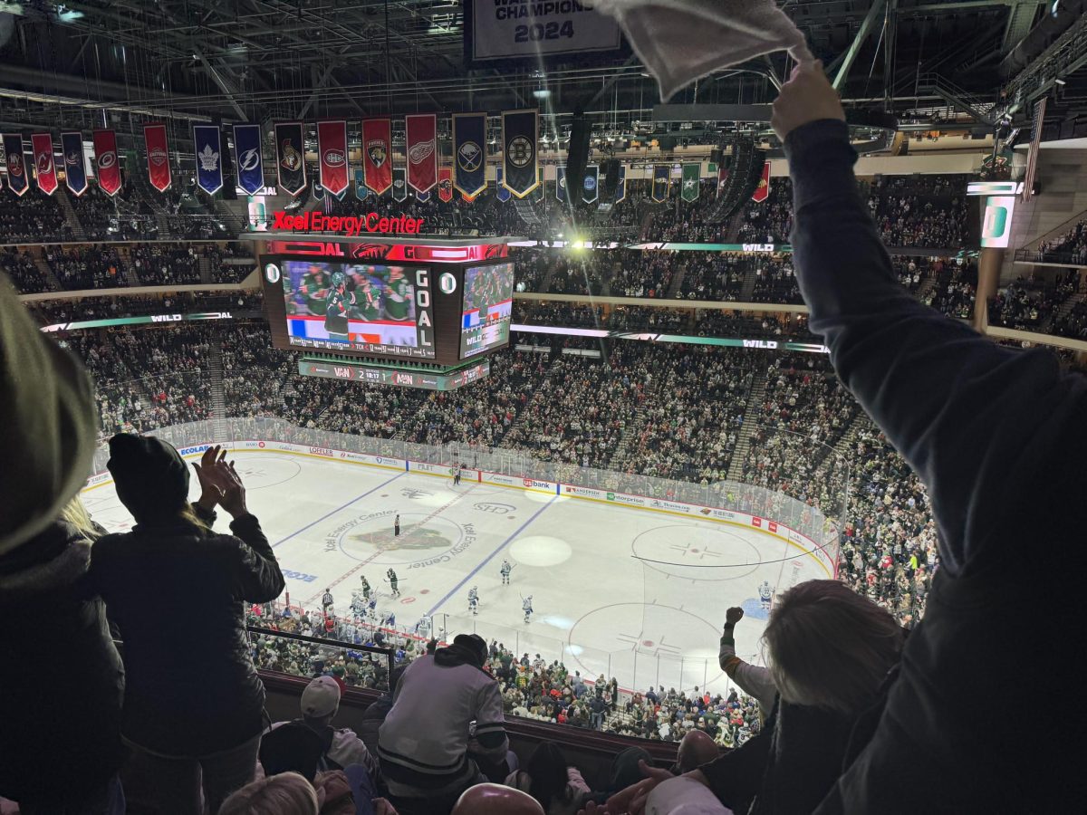 sirens blaring rights flashing crowd cheering after Jake middleton scored tieing the game 2-2. everyone jumps to their feet once he scores.