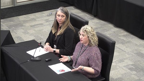 Integration Coordinator Jacquelene Bayless and Caitlyn Willis Executive Director of Elementary Education present on the identity harm protocol to the school board on Dec. 17, 2024.  Before Bayless started sharing, there were several community members who tried to oppose this protocol.