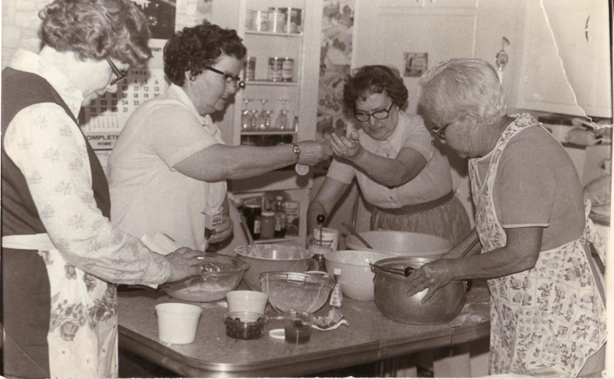 Four women gather around to cook before Easter. Women have generally been stereotyped to work in the kitchen and prepare the meals.