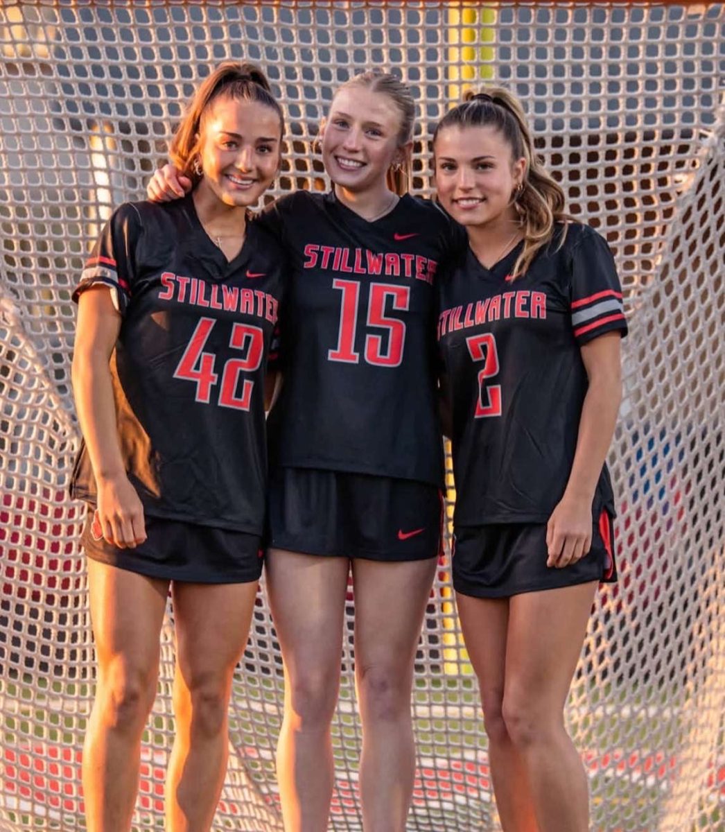 From left to right in the photo is senior Mady Richert, senior Rayna Malmberg and senior Gretchen Wenner. this was final team picture day on April 9, at the Ponies Stadium. 