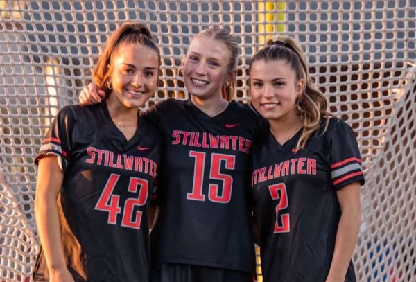 From left to right in the photo is senior Mady Richert, senior Rayna Malmberg and senior Gretchen Wenner. this was final team picture day on April 9, at the Ponies Stadium. 