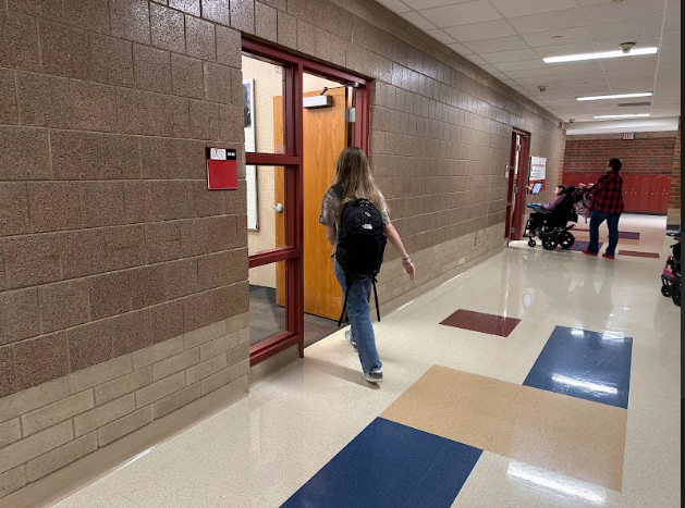 Student Maggie Offord walks into her second hour after class has started. Attendance is a very important part of life and being late or missing is becoming a problem in schools.