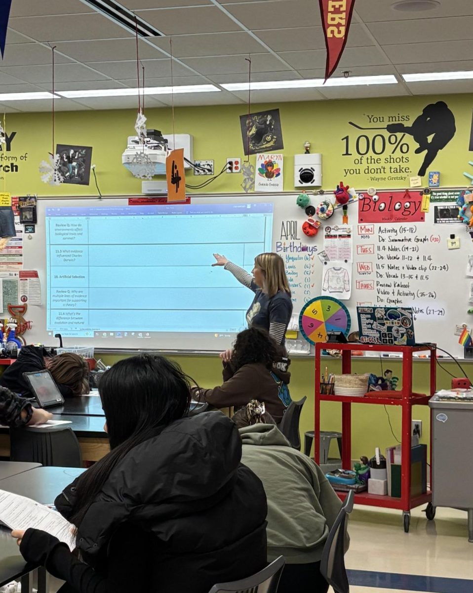This photo shows Stacy Bartlett teaching her class about their biology lesson for the day. She teaches vital information as best she can, and she wants to make sure her students understand and feel comfortable.