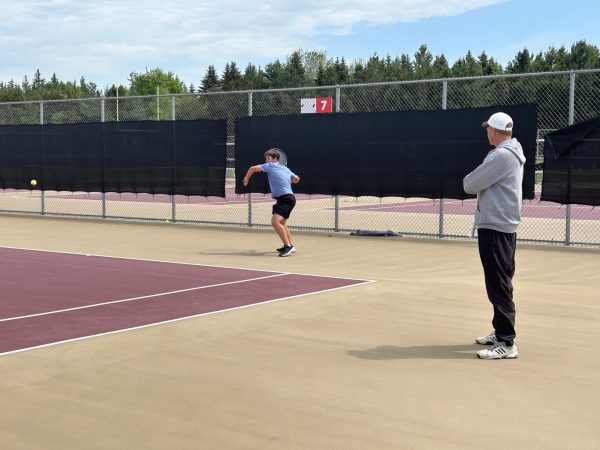 Coach Jay Knutson focused on a player's swing that he has been perfecting for months. He analyzed the body language of freshman Josh Severson to see where his head was at.