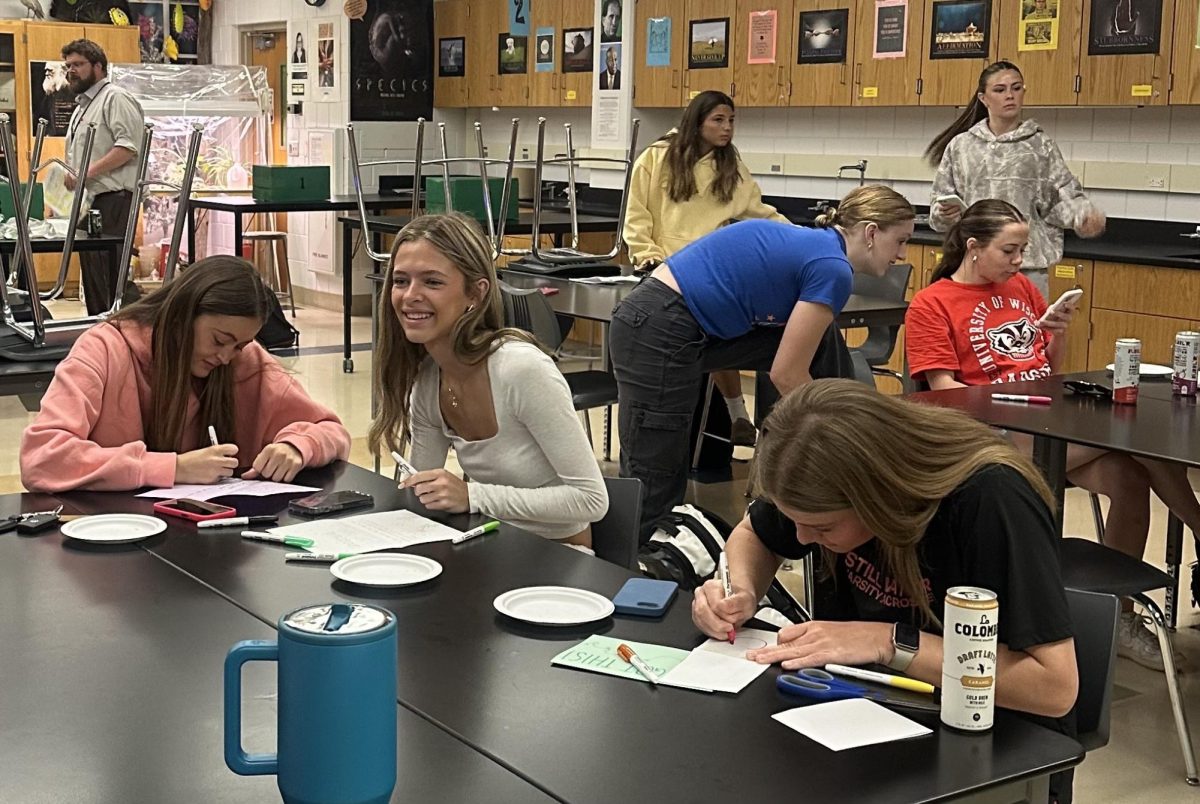 Students Lucy Boldenow and Greta Kindler meet on May 8, the first day of club, in action creating cards. The cards were sent to mental health patients at the St. Paul Mental Facilities. The cards were made for inspiration towards their community.