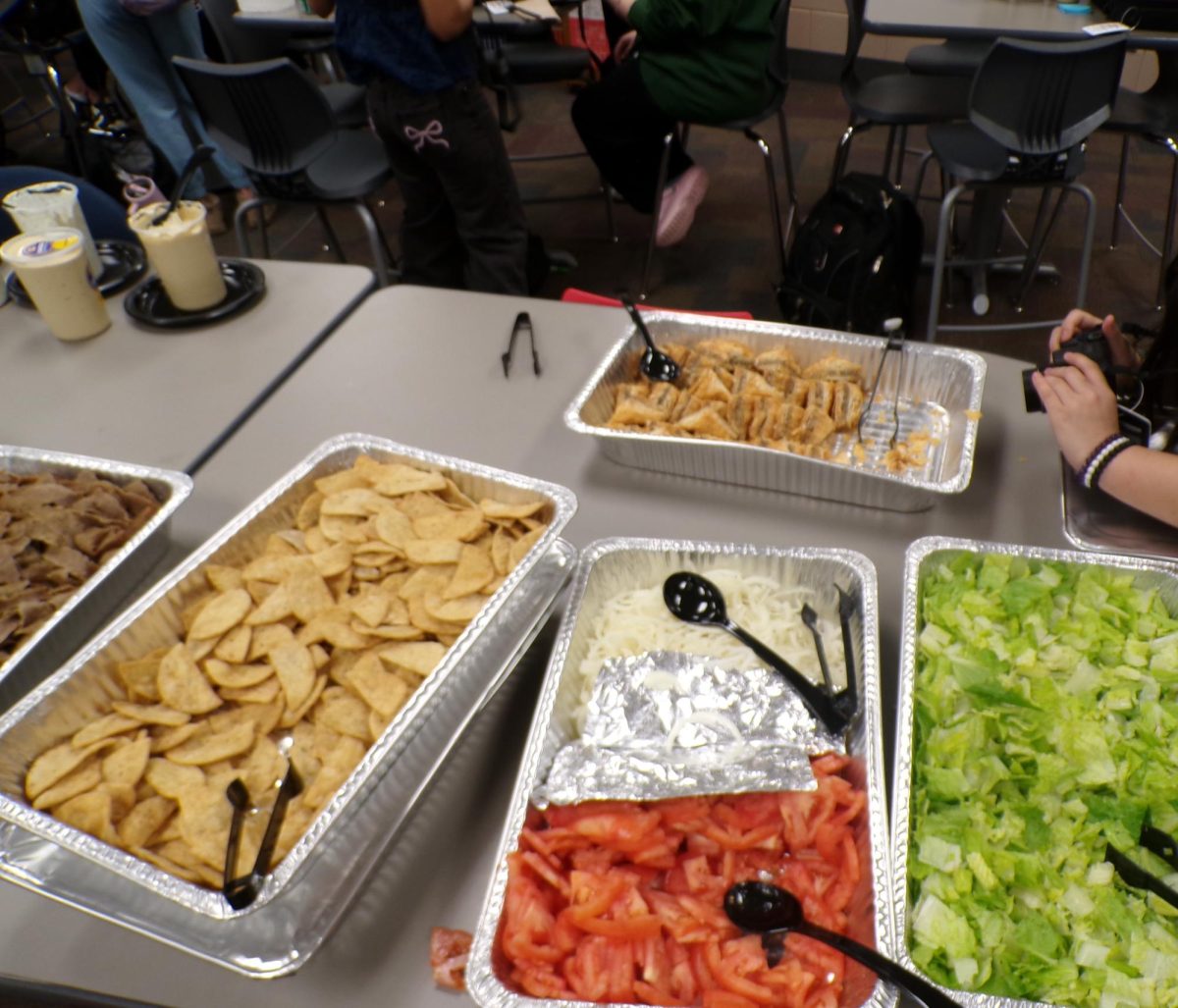 An Overview of the buffet line, each tray filled with an element to build the gyro. The smell of onion filled the room, pungent and garlicky.
