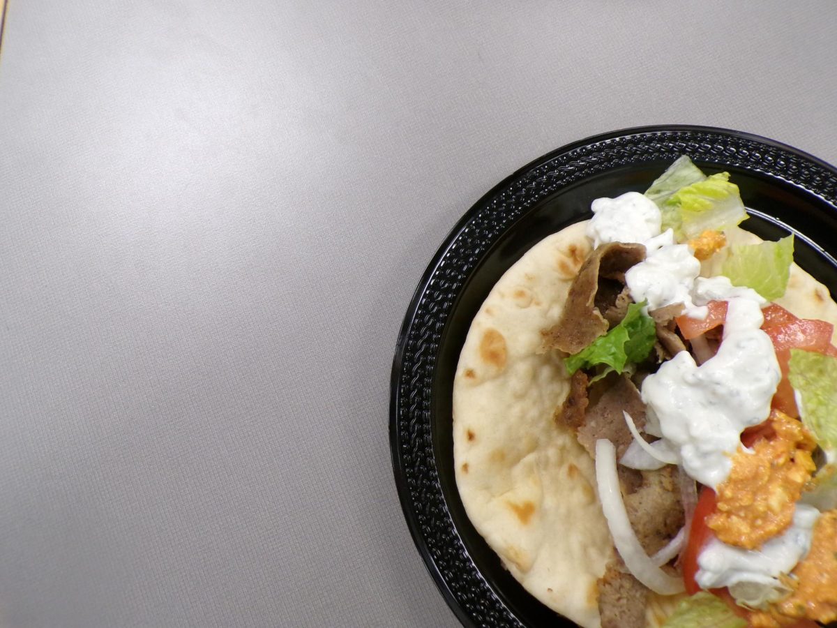 A freshly made gyro sits wrapped in warm pita bread, filled with seasoned meat, tomatoes, onions and tzatziki sauce. The dish is a staple menu item at Greek restaurants across Minnesota.