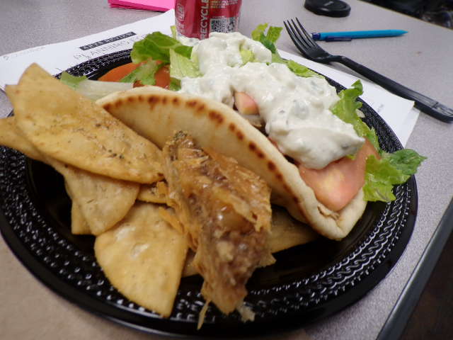 fresh tastful gyro. with the nutty treat and a side of crispy chips. 