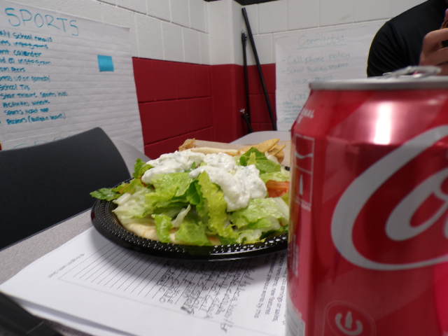 gryo lunch with fresh veggies.On the side sweet coke.