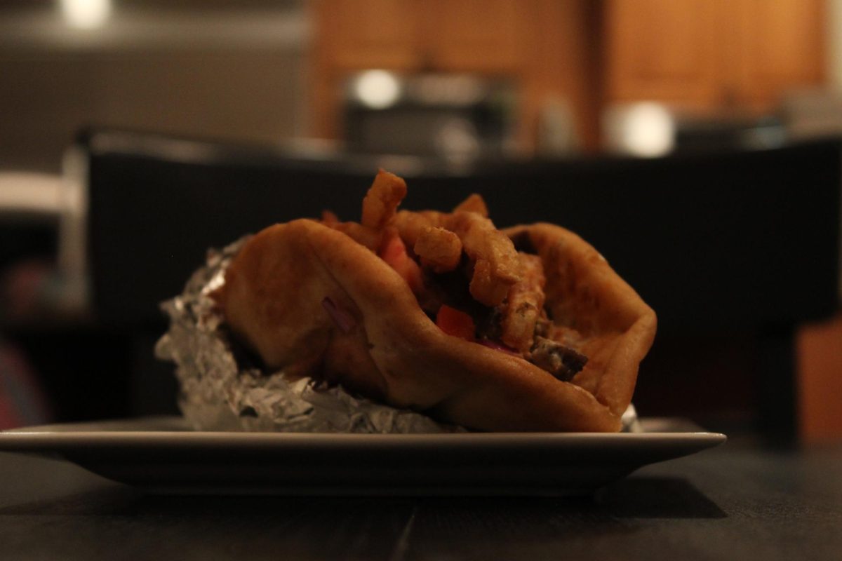 Warm, fluffy pita wrapped around layers of juicy chicken and rich lamb. Everything looks fresh, stacked and ready to fall apart in the best way.