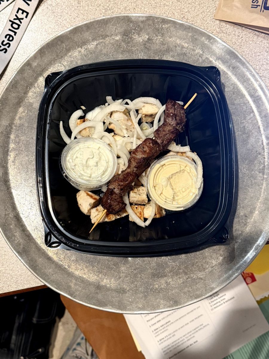 This Gyro plate has cool, crisp onions with charred beef that still looks juicy and contains addicting grilled chicken. The yogurt-flavored tzatziki and hummus sides are an option, but an important flavor aspect.  