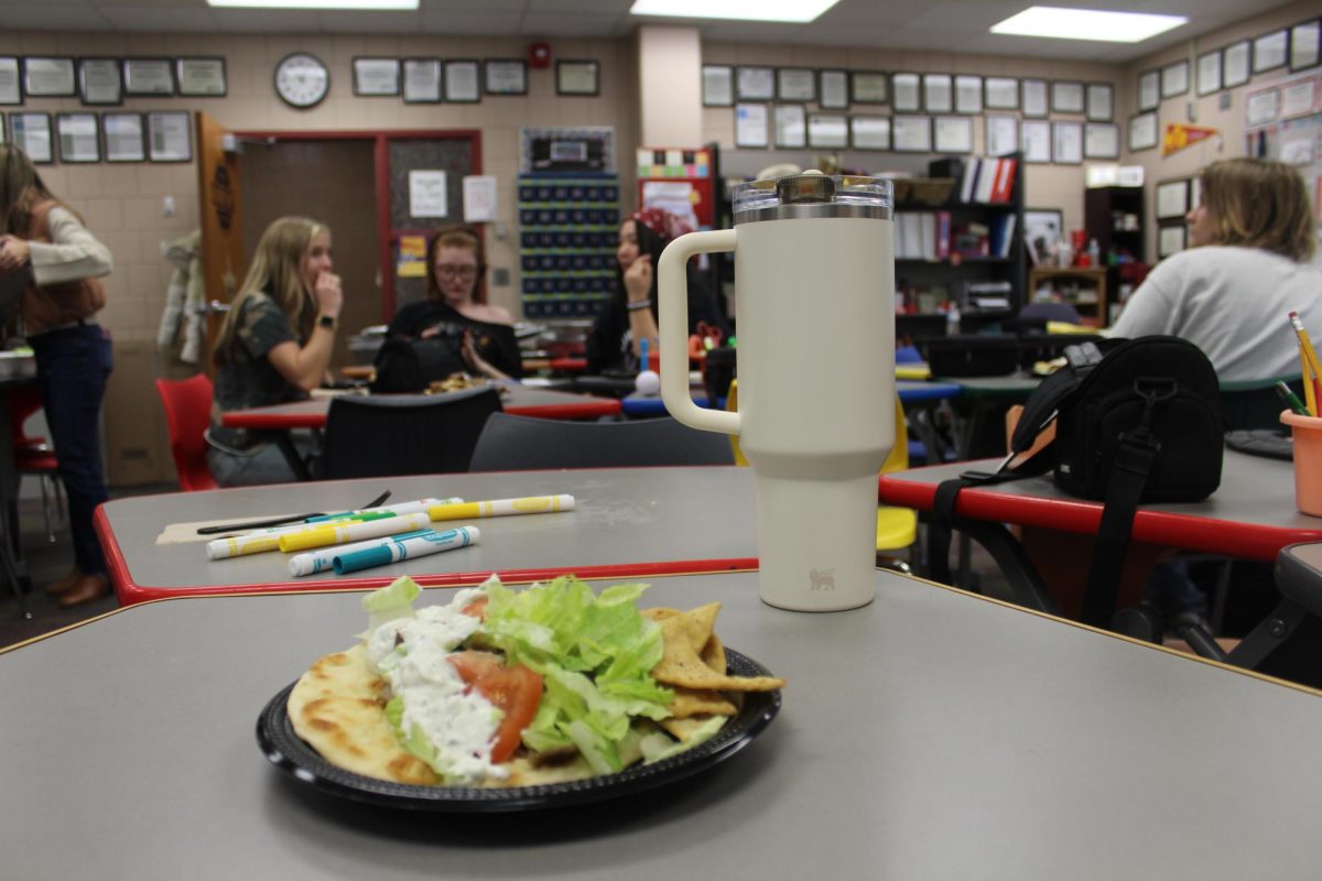 Other elements on the table and in the background are included to give context and show the setting while keeping the meal as the main focus