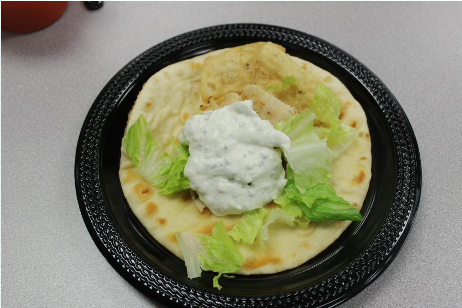 This is my pita with sliced gyro meat topped with fresh lettuce and creamy Tzatziki sauce. The Tzatziki sauce gave the gyro a cool savory flavor.