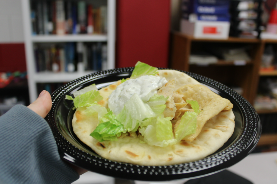 A handmade gyro packed with thinly sliced meat, fresh toppings and white Tzatziki sauce plopped on top. It tasted warm, with juicy meat and creamy tangy sauce.