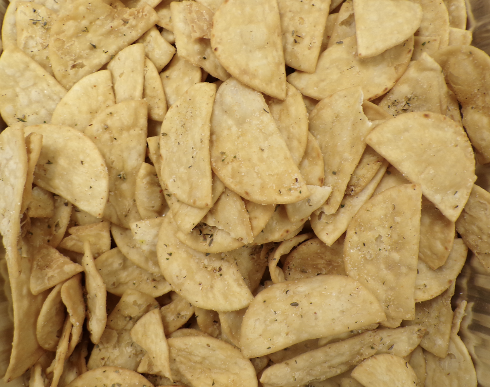 Homemade pita chips from Dino’s Gyros, perfectly seasoned and served fresh.

